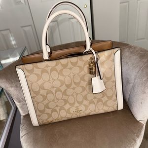 Coach crossbody, handbag, very elegant, suits everything white, tan bag.